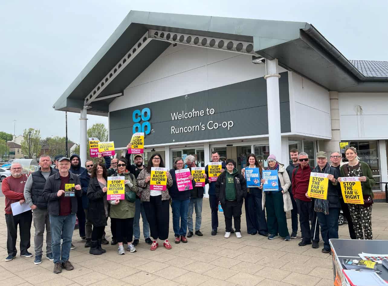 Supporters of stand up to racism with anti reform uk leaflets in Runcorn