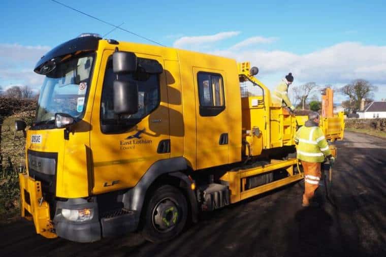 Council workers in Scotland filling potholes (Pic: Jennifer Petrie)